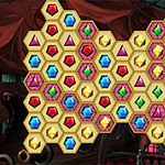 Šareni heksagonalni dragulji poređani u obliku srca na tamnoj pozadini