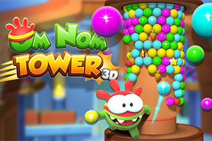 Om Nom uz kulu od šarenih loptica u igri Om Nom Tower 3D