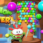 Om Nom uz kulu od šarenih loptica u igri Om Nom Tower 3D
