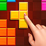 Prst koji dodiruje žuti Tetris blok na digitalnom ekranu sa šarenim kockama
